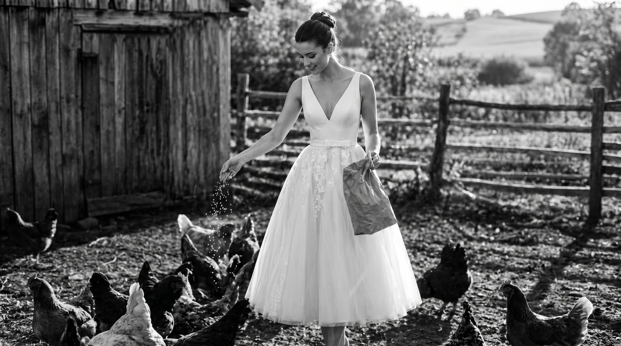 Bride in a tea-length gown feeding chickens beside a wooden barn — BOE campaign