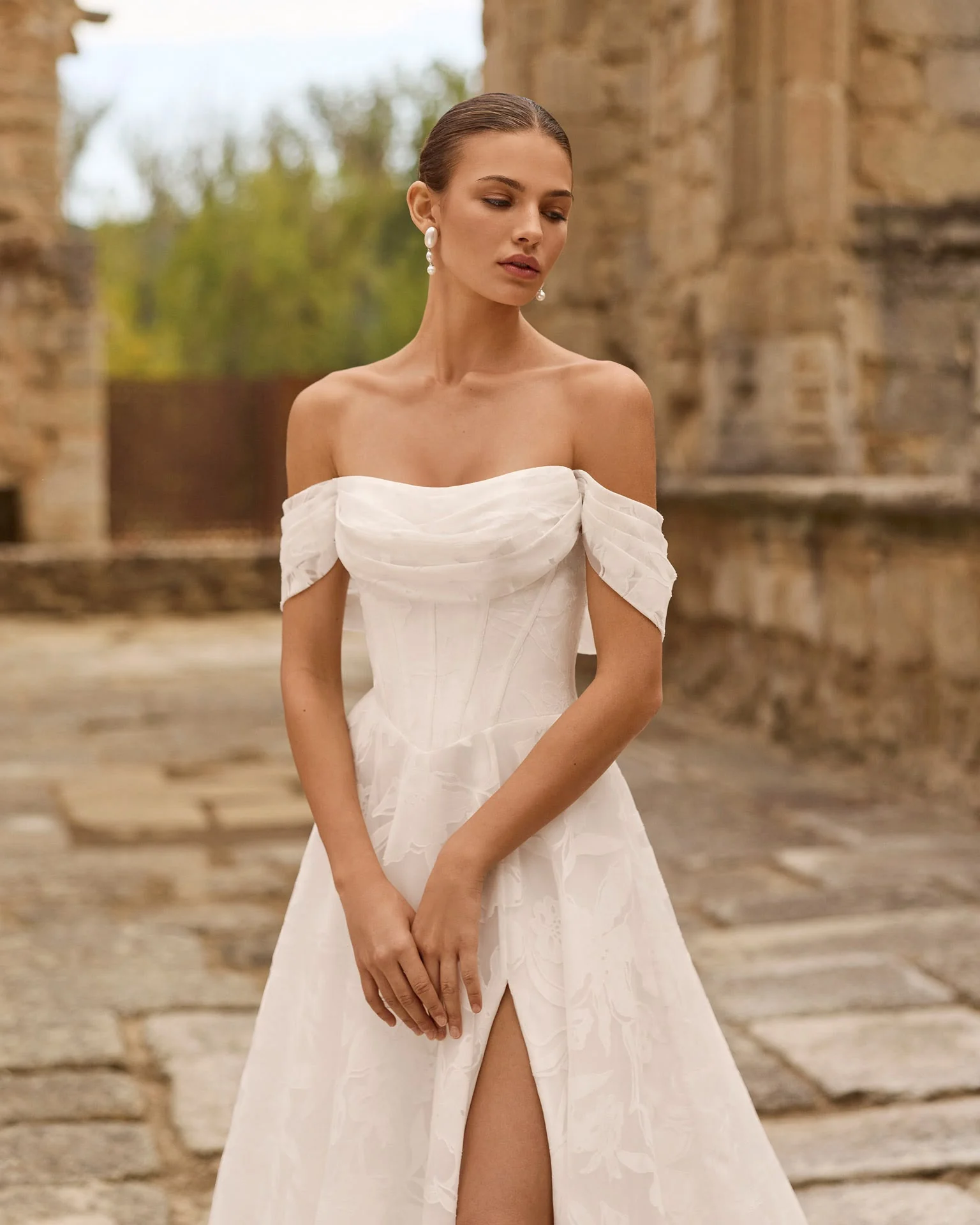 Adriana Alier Piscilo 2N39 wedding dress — draped off-shoulder bodice detail